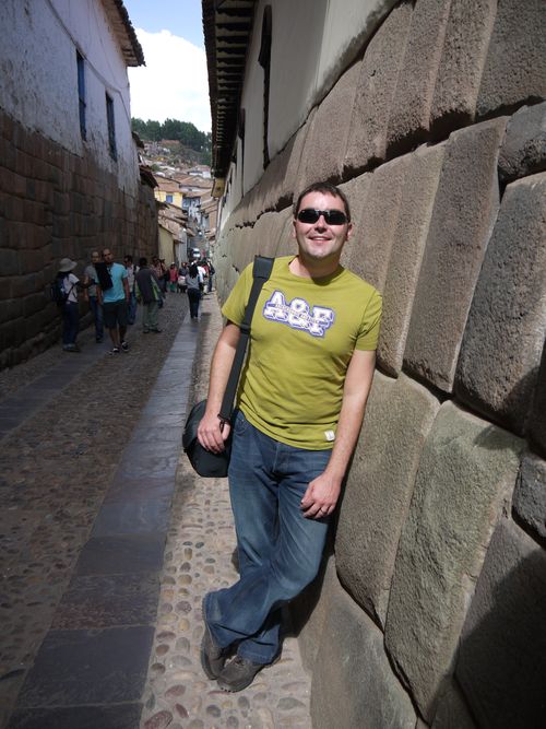 Paul light headed leaning on the Inca wall